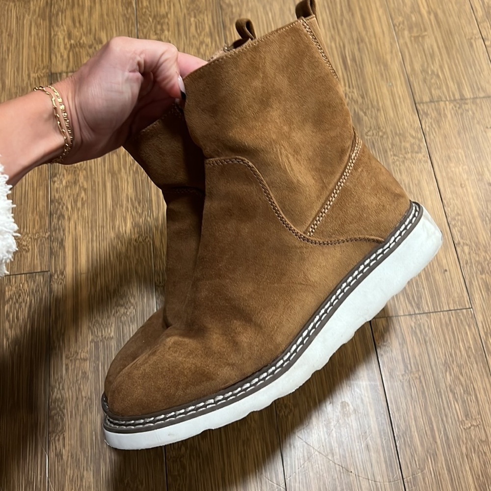 Brown suede boots.